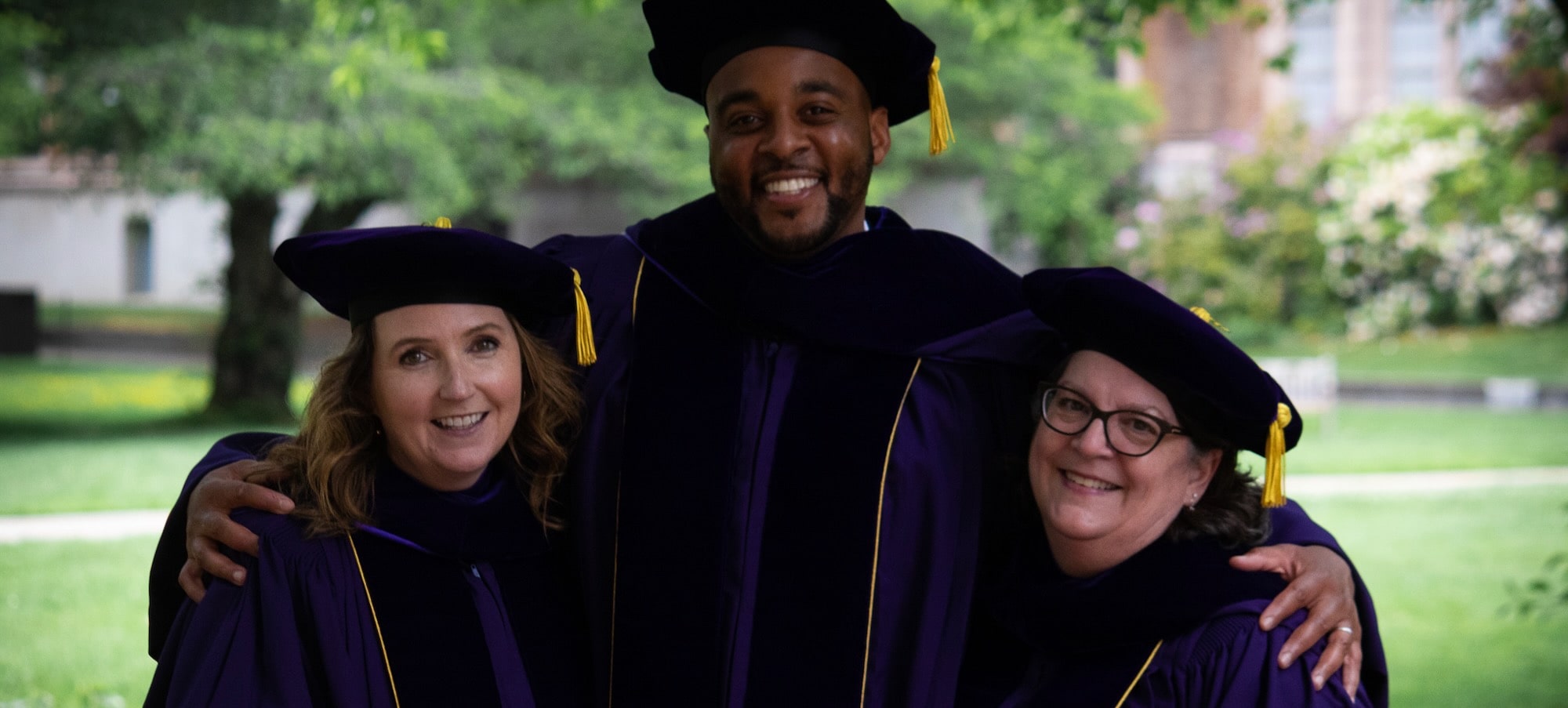 Three L4L graduates on graduation day
