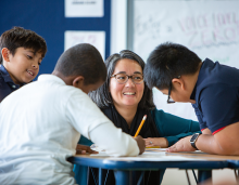 Teacher working with elementary students